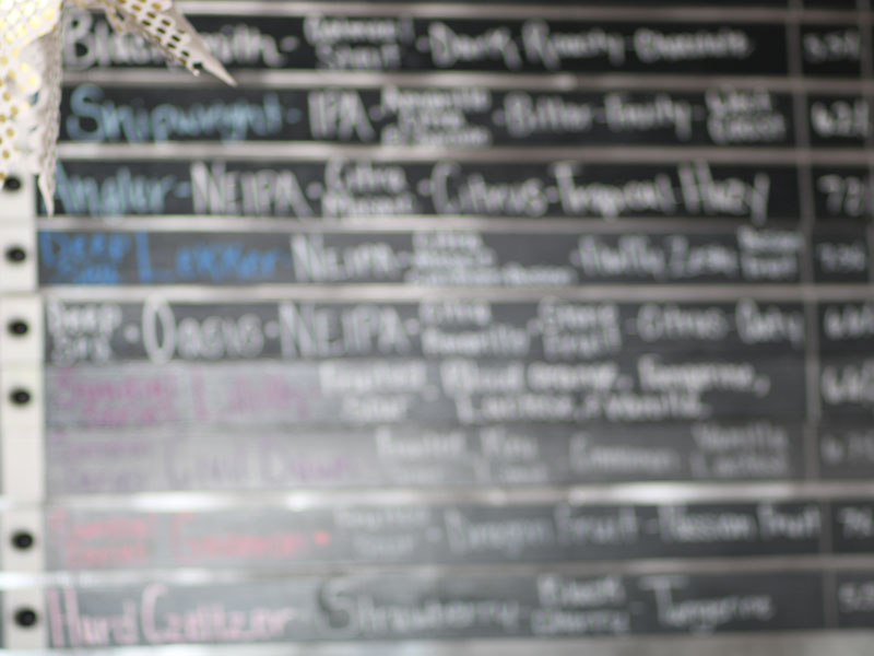 Blurred tapboard of beers at Czig Meister.
